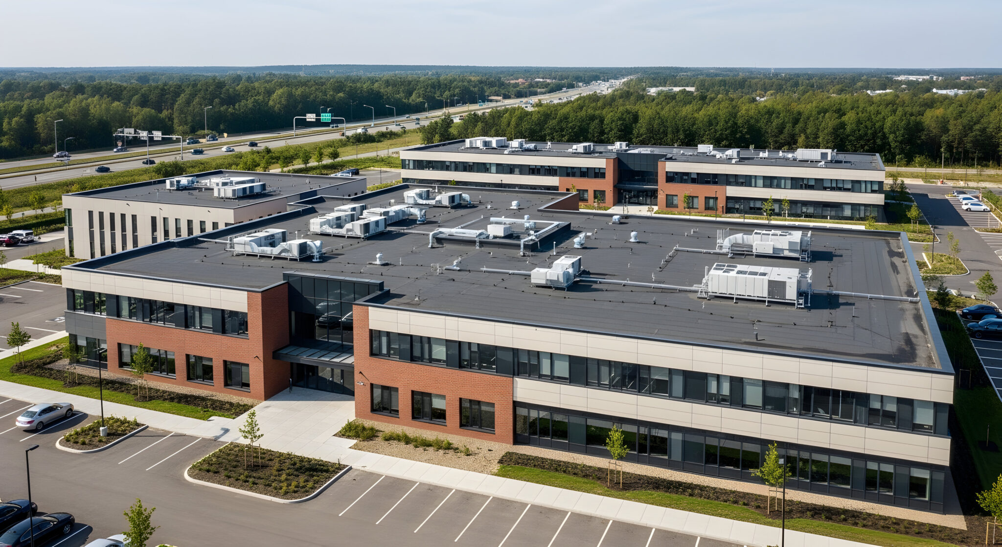 EPDM rubber flat roofing installation on a Massachusetts commercial building commerical flat roofing
