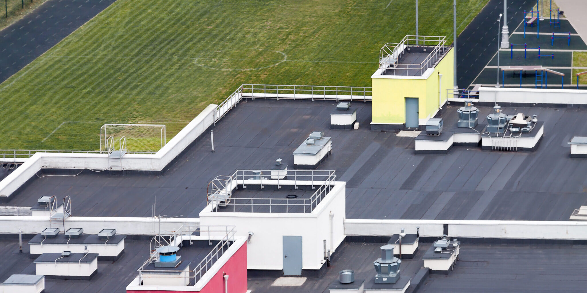 EPDM rubber flat roofing installation on a Massachusetts commercial building commerical flat roofing